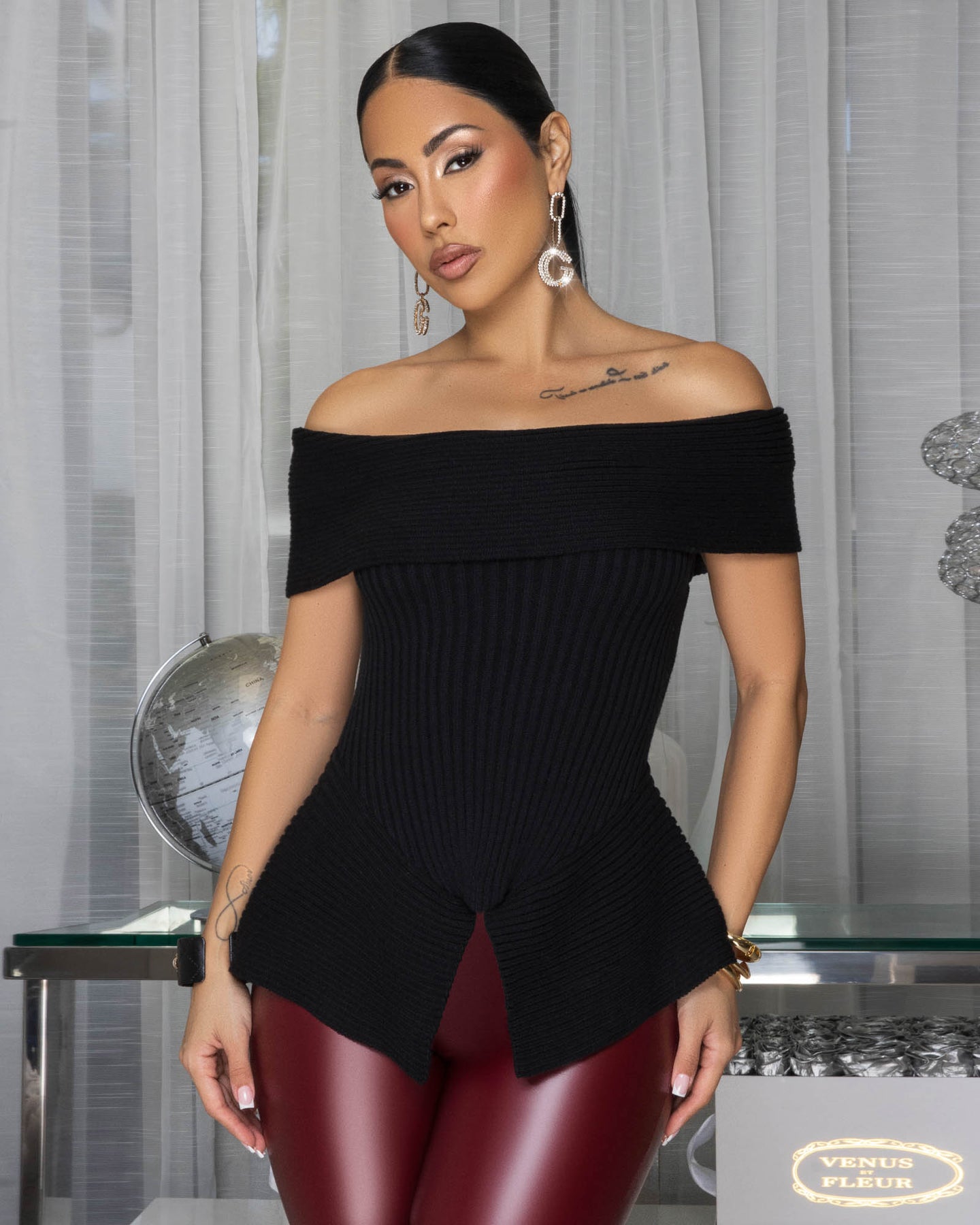 Nichelle Black Ribbed Peplum Sweater Top